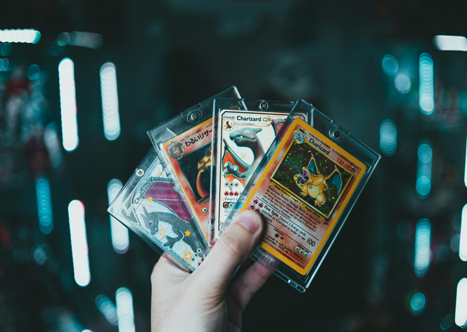 A Person Holding Trading Cards